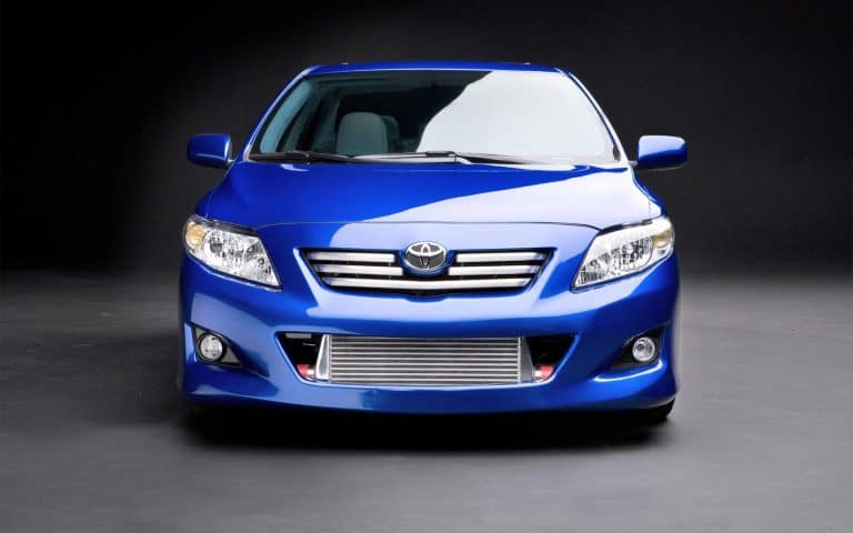 High-performance blue car with upgraded turbo intercooler, front view, showcasing modern design and automotive technology.